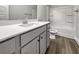 Modern bathroom with a gray vanity, sleek countertop, and a combined shower and tub at 5291 Tuscany Dr, Douglasville, GA 30135