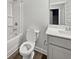 Clean bathroom with shower-tub combo, neutral colors, and modern sink at 5291 Tuscany Dr, Douglasville, GA 30135