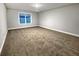 Cozy carpeted bedroom with a window for natural light; a peaceful retreat at 5291 Tuscany Dr, Douglasville, GA 30135