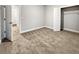 Spacious bedroom with neutral carpet, gray walls, and walk-in closet; perfect for relaxation at 5291 Tuscany Dr, Douglasville, GA 30135