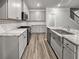 Modern kitchen featuring gray cabinets, granite countertops, and stainless steel appliances at 5291 Tuscany Dr, Douglasville, GA 30135