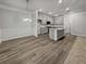 Open concept kitchen features a center island, stainless appliances, and hardwood floors at 5291 Tuscany Dr, Douglasville, GA 30135
