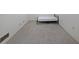 Basement bedroom with gray carpet, a bed frame, and white walls, creating a simple design at 6835 Castleton Dr, Sandy Springs, GA 30328