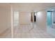 Spacious basement with tile flooring leading to another room with a standing shower at 6835 Castleton Dr, Sandy Springs, GA 30328
