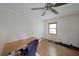 Bedroom featuring hardwood floors with a built-in desk and natural light at 6835 Castleton Dr, Sandy Springs, GA 30328