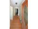 Inviting hallway with hardwood floors and decorative front door, offering a warm welcome at 6835 Castleton Dr, Sandy Springs, GA 30328