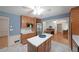 Spacious kitchen with plentiful cabinet space, stainless steel appliances, and an adjacent living space at 6835 Castleton Dr, Sandy Springs, GA 30328