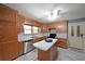 Updated kitchen featuring sleek appliances, custom cabinetry, and a functional center island at 6835 Castleton Dr, Sandy Springs, GA 30328