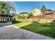 Beautiful backyard with green grass, a patio, and a sunroom attached to the house at 1172 Rockmart Nw Cir, Kennesaw, GA 30144
