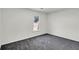 Neat bedroom with neutral walls, gray carpet, and a window that lets in plenty of natural light at 1172 Rockmart Nw Cir, Kennesaw, GA 30144