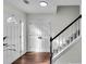 Welcoming entryway featuring beautiful hardwood floors, staircase and natural light at 1172 Rockmart Nw Cir, Kennesaw, GA 30144