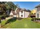 Charming two-story home with manicured lawn and classic architectural details at 1172 Rockmart Nw Cir, Kennesaw, GA 30144