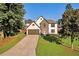Beautiful two-story home on a well-manicured lawn with shade trees at 1172 Rockmart Nw Cir, Kennesaw, GA 30144