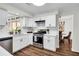Bright, well-appointed kitchen featuring stainless steel appliances, white cabinetry, and sleek countertops at 1172 Rockmart Nw Cir, Kennesaw, GA 30144