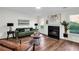 Bright and spacious living room boasts a fireplace, stylish furniture, and large windows for ample natural light at 1172 Rockmart Nw Cir, Kennesaw, GA 30144