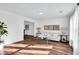 Bright living room with modern decor, hardwood floors, and a large window overlooking the backyard at 1172 Rockmart Nw Cir, Kennesaw, GA 30144