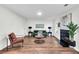 Spacious living area with wood floors, fireplace, and natural light, creating a warm and inviting atmosphere at 1172 Rockmart Nw Cir, Kennesaw, GA 30144