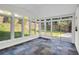Sunroom featuring large windows, colorful tiled flooring, and views of a grassy backyard at 1172 Rockmart Nw Cir, Kennesaw, GA 30144