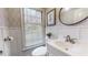 Elegant half bath featuring decorative wallpaper, wainscoting, and modern sink fixtures at 2151 Desmond Dr, Decatur, GA 30033