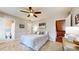 Cozy bedroom features a ceiling fan, neutral walls, and adjacent bathroom and hallway entrances at 2151 Desmond Dr, Decatur, GA 30033