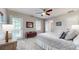 Bright bedroom with a ceiling fan, neutral walls and carpet, and a door leading outside at 2151 Desmond Dr, Decatur, GA 30033