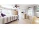 Comfortable bedroom with neutral colors, ceiling fan, decorative curtains, and great natural light at 2151 Desmond Dr, Decatur, GA 30033