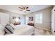 Well-lit bedroom with a ceiling fan, neutral walls, and a window overlooking the outdoors at 2151 Desmond Dr, Decatur, GA 30033