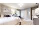 Well-lit bedroom with a ceiling fan, neutral walls, and a window overlooking the outdoors at 2151 Desmond Dr, Decatur, GA 30033