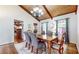 Cozy dining room features wood floors, exposed beams, and a stylish chandelier at 2151 Desmond Dr, Decatur, GA 30033