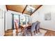 Charming dining room with wood floors, vaulted ceilings, chandelier, and a full dining set at 2151 Desmond Dr, Decatur, GA 30033