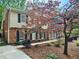 Charming two-story home with a brick facade, second story balcony, and well-maintained landscaping at 2151 Desmond Dr, Decatur, GA 30033