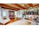Open-concept living space showcases hardwood floors, wooden beam ceiling, and an adjacent dining area at 2151 Desmond Dr, Decatur, GA 30033