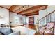 Inviting living area with hardwood flooring, wooden beam ceiling, and comfortable seating arrangement at 2151 Desmond Dr, Decatur, GA 30033