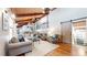 Cozy living room features wood ceiling with beams, stylish furniture, sliding barn door, and hardwood floors at 2151 Desmond Dr, Decatur, GA 30033