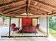 Inviting covered patio featuring red accents and comfortable seating, perfect for outdoor relaxation at 2151 Desmond Dr, Decatur, GA 30033