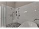 Bathroom with white tiled walls, modern shower, and standalone bathtub at 2895 Cross Creek Dr, Cumming, GA 30040