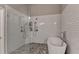 Bathroom with white tiled walls, modern shower, and standalone bathtub at 2895 Cross Creek Dr, Cumming, GA 30040