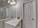 Bathroom includes a modern vanity and a view of the tiled shower at 2895 Cross Creek Dr, Cumming, GA 30040