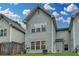 A well maintained exterior with gray siding, white trim, and a private backyard space at 2895 Cross Creek Dr, Cumming, GA 30040