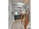 Inviting foyer with hardwood floors, a staircase with iron spindles and a view into the living room at 2895 Cross Creek Dr, Cumming, GA 30040