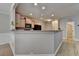 Kitchen area with modern appliances, wooden cabinets and a breakfast bar at 2895 Cross Creek Dr, Cumming, GA 30040