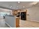 Well-lit kitchen featuring wooden cabinets, black appliances, and a breakfast bar at 2895 Cross Creek Dr, Cumming, GA 30040