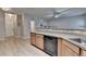Open-concept kitchen featuring stainless steel appliances, plenty of countertop space, and a view into the adjacent room at 2895 Cross Creek Dr, Cumming, GA 30040