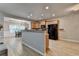 Kitchen with black appliances, wood cabinets, and an island with bar seating at 2895 Cross Creek Dr, Cumming, GA 30040