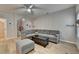 Cozy living room featuring a gray sectional sofa, coffee table, and an ottoman at 2895 Cross Creek Dr, Cumming, GA 30040