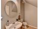Cozy powder room with decorative mirror and vanity, perfect for guests at 2895 Cross Creek Dr, Cumming, GA 30040