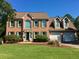 Charming brick two-story home with a well-manicured lawn and a two-car garage at 323 Dewpoint Ct # 35, Marietta, GA 30064