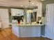 View of the kitchen showcasing the center island, sink, and white cabinetry at 323 Dewpoint Ct # 35, Marietta, GA 30064