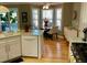 Bright kitchen with hardwood floors, white cabinets and stainless steel appliances at 323 Dewpoint Ct # 35, Marietta, GA 30064