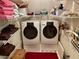 Laundry room features a washer and dryer as well as open shelving for optimal storage space at 323 Dewpoint Ct # 35, Marietta, GA 30064
